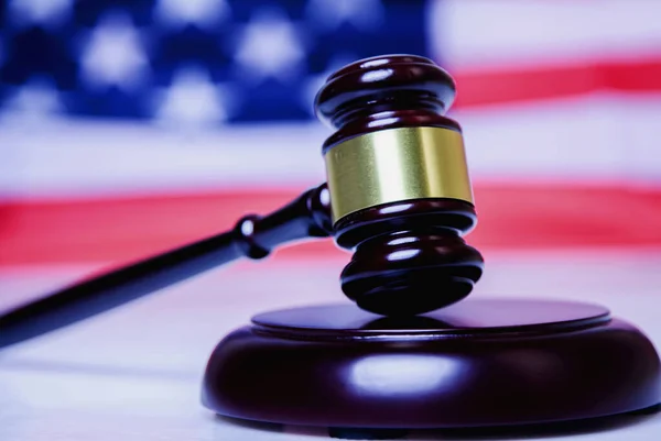 stock image Judge gavel against United States national flag as symbol of judicial system of the USA. Justice, equity, law and human freedom concept. 