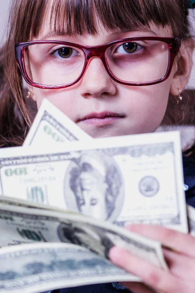 Business finance, banking and money concept. Portrait of young pretty girl with lot of money.