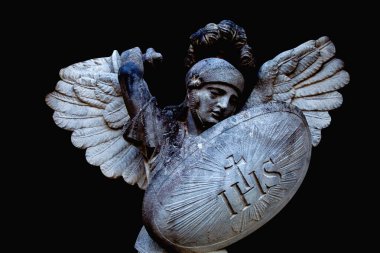 Angel struggles with evil. Fragment of antique statue. Good triumphs over evil concept. 