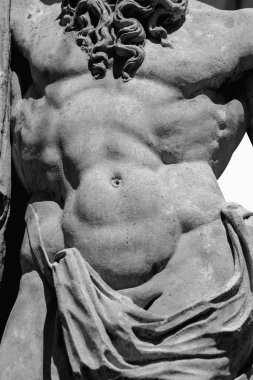 Torso (body) of antique god Hercules (Heracles) as symbol of power and strength.