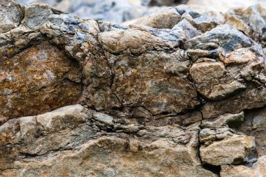 Cracked stone wall background. Copy space for design. Horizontal image.