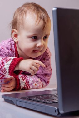 Humorous image of little business child girl works at home and virtual video conference meeting with colleagues, online working, video call due to social distancing at home office