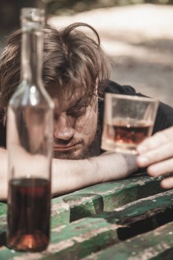 Addiction and Inner Emptiness: psychological problems of people. Antisocial behavior of a young man escapes reality and life's unlived difficulties. Vertical image.