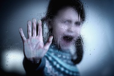 Portrait of young child girl showing Stop signal with her hand. 