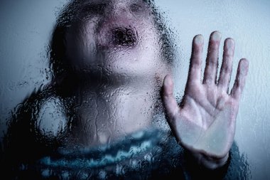 Dramatic portrait of young child girl showing Stop signal with her hand. 