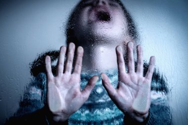 Brunette young girl doing stop singing with palm of the hand. Warning gesture.