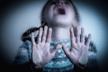Close up of young girl stretching hand and protesting against domestic violence. Teen child stands against discrimination and child abuse.