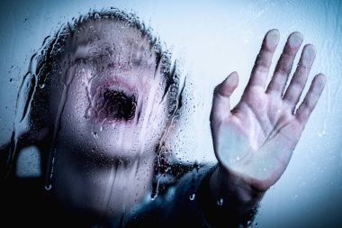 Young child girl showing STOP gesture with her hand. Concept of domestic violence and child abuse. 