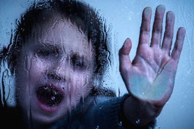 Young child girl showing Stop signal with her hand.