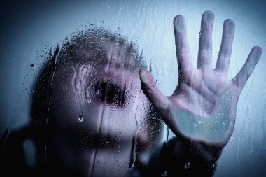 Young girl showing STOP gesture with her hand. Concept of domestic violence and child abuse.  Protest against domestic violence, against discrimination or school abuse. Horizontal image.