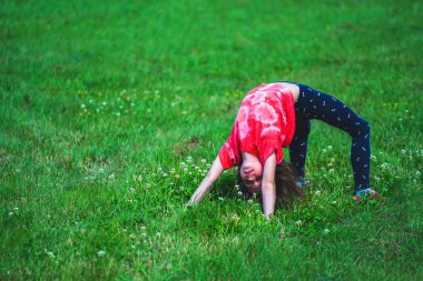 Yoga classes outside on the open air. Kids Yoga concept. Horizontal image. Copy space.