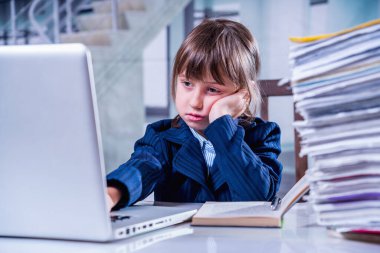 I hate my office work. Tired and exhausted young business girl working overtime alone in office without cariere perspective and additional payments