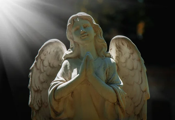 Saint beautiful angel struggles with evil. Fragment of antique statue. Good triumphs over evil concept.