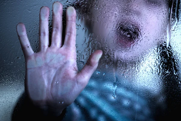 Portrait of young child girl showing STOP gesture with her hand. Concept of domestic violence and child abuse. Copy space.