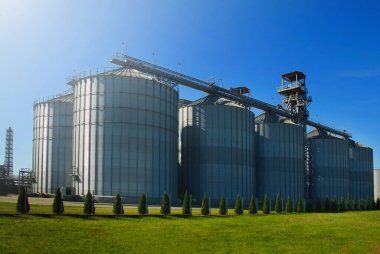 Granary. Modern agro-processing plant for the storage and processing of grain crops. Horizontal image. clipart