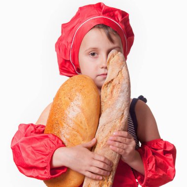 Genç, güzel, fırında baget ve kepek ekmekli fırıncı kadın aşçı. Buğday üretimi, endüstri, gıda kavramı.