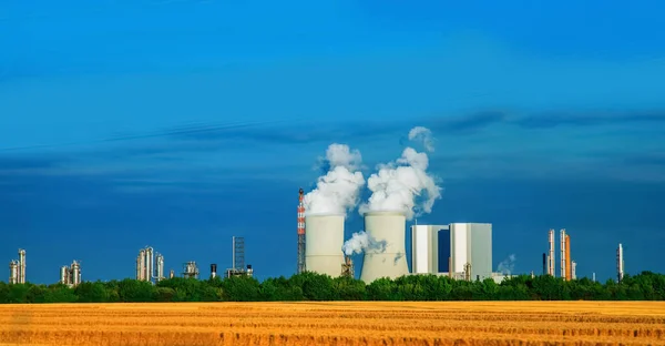 Power engineering and electric power generation concept. Cooling Tower and thermal power station. In thermal power station heat energy is converted to electric power. Horizontal image.
