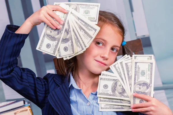 Make money online for beginners. Beautiful young girl enjoys money profits