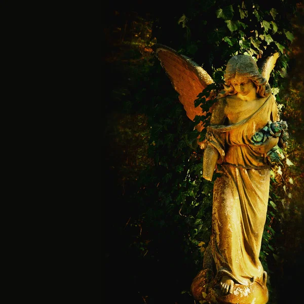 Beautiful sad angel. Ancient statue. Copy space.