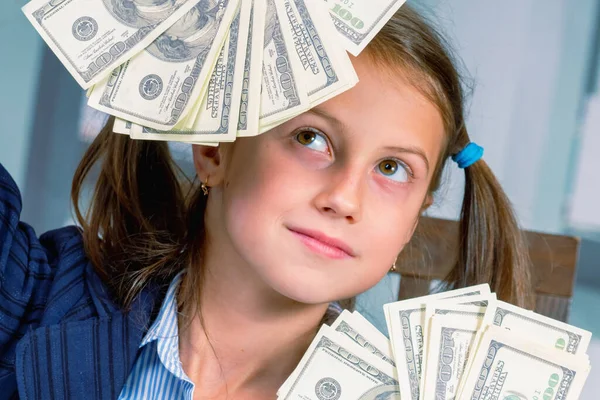 Make money online for beginners. Portrait of beautiful young girl enjoys money profits. Horizontal image.