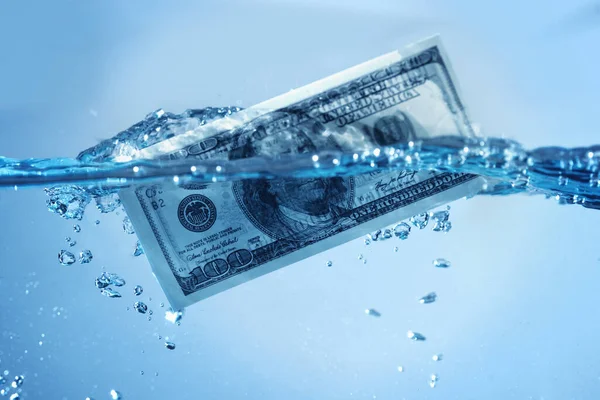 Global financiall crisis. US Dollar sinking in water