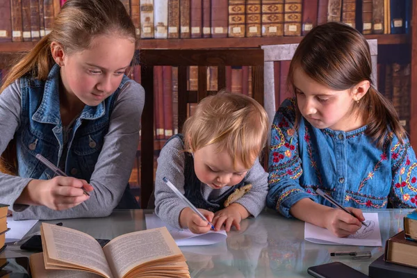 Conceptual image: child development and early learning. Young scientists study in the library and read books. Humorous photo.