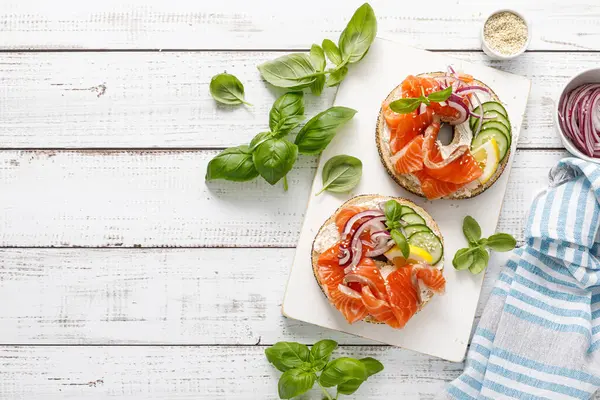 Salmon Sandwiches Bagel Salted Fish Fresh Cucmber Onion Basil White Royalty Free Stock Images