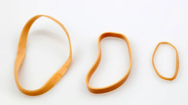 Three Rubber Bands Plain Backgroun — Stock Photo, Image