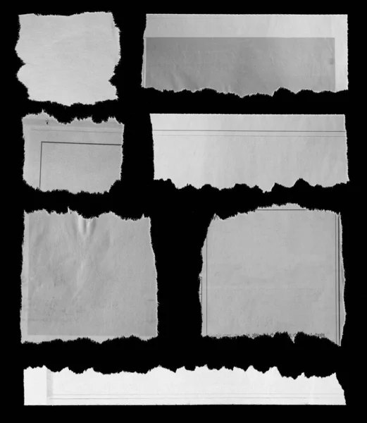Seven Pieces Torn Newspaper Black Background — Stock Photo, Image
