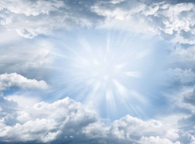 Bright rays shining in clouds clipart