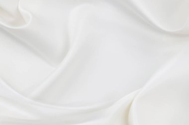 Dalgalı beyaz ipek kumaş dokusu.