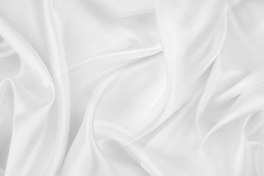 Dalgalı beyaz ipek kumaş dokusu.
