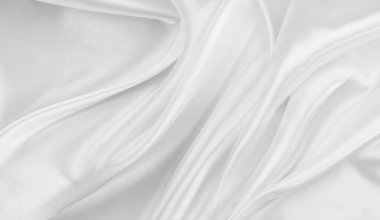 Dalgalı beyaz ipek kumaş dokusu.