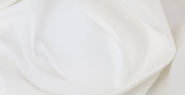 Dalgalı beyaz ipek kumaş dokusu.