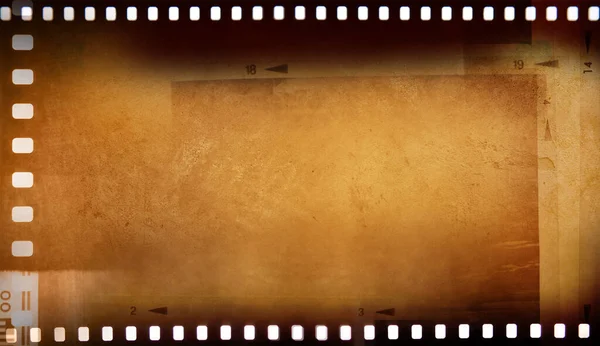フィルムネガティブフレーム茶色の背景 — ストック写真