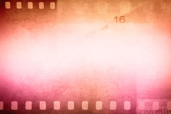 Orange pink film negative frames background. Copy space