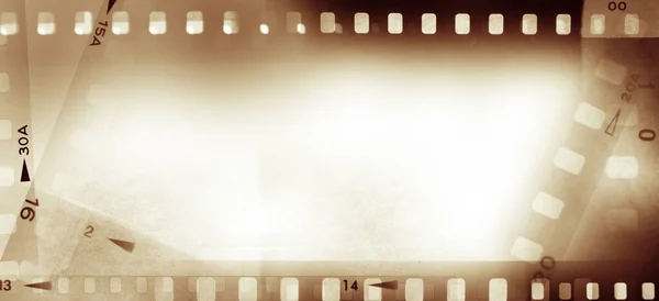 Film Negatif Çerçeveler Kahverengi Arka Plan — Stok fotoğraf