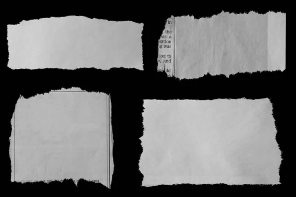 Four Pieces Torn Newspaper Black Background — Stock Photo, Image