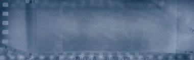 Film negatifleri mavi arkaplanı çerçeveler. Boşluğu Kopyala