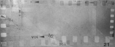 Film negatives frames grey backgroun clipart