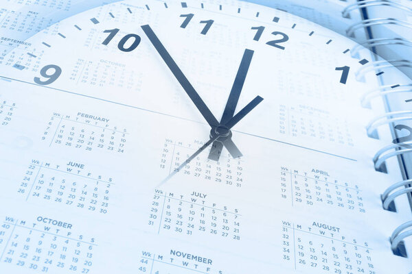 Clock face and calendar page. Time management