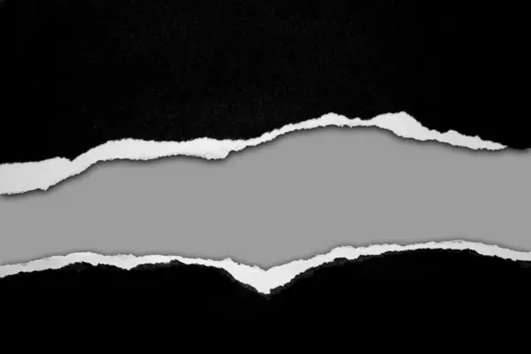 Zerrissenes Schwarzes Papier Auf Grauem Hintergrund Stockbild