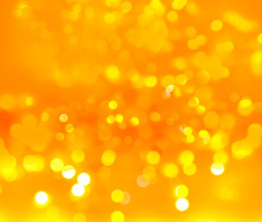 Turuncu ve sarı ışık soyut arkaplanı bulanıklaştırır
