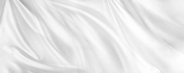 Dalgalı beyaz ipek kumaşın yakın çekimi