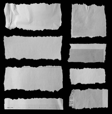 Siyah arka planda sekiz parça yırtık gazete