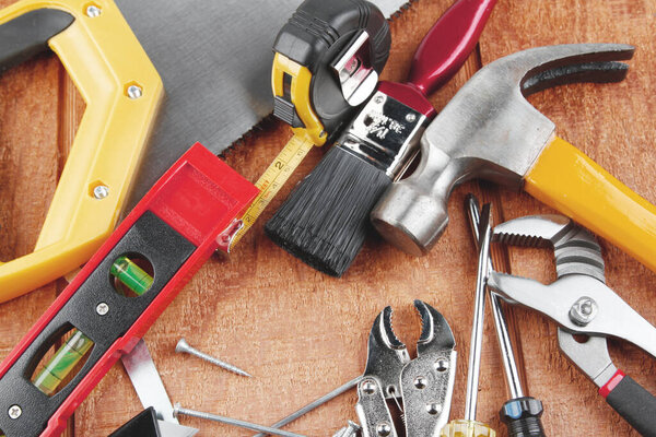 Assorted work tools on wood
