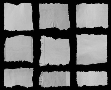 Siyah arka planda yırtık gazete dokuz adet