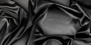 Dalgalanan siyah ipek kumaşın yakınlaştırılması