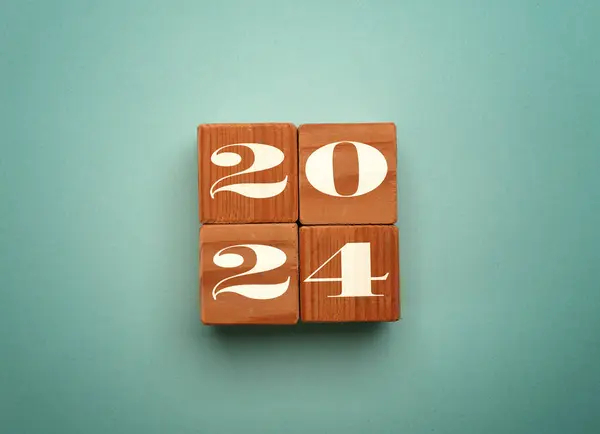Wooden blocks with the Year number 2024, New Year concept, seasonal Christmas time