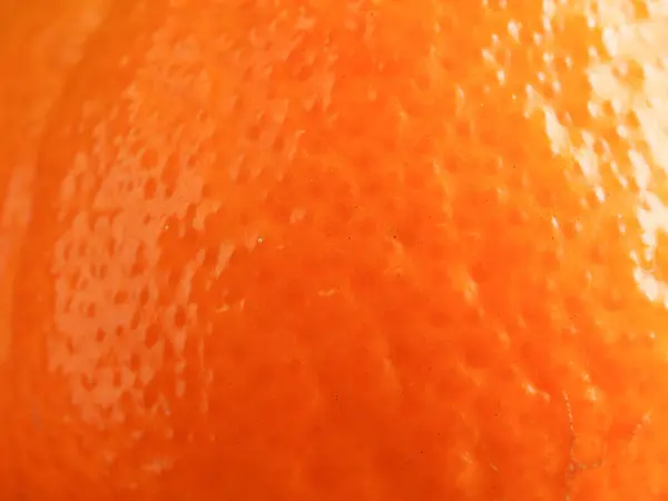 Close up macro shot of orange skin using as background